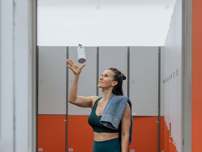 Water bottle and a towel in a dark room
